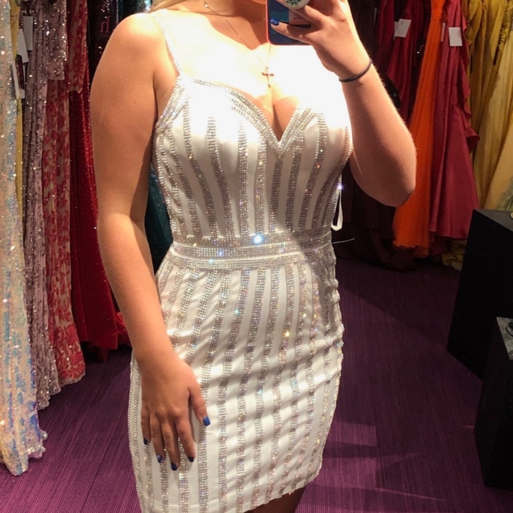 New with tags. Never been worn. Paid 600, asking 500!